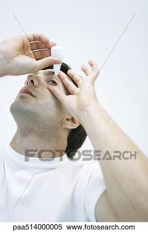 Man applying eye drops, head back View Large Photo Image Stock Photography - Man applying eye drops, head back. Fotosearch