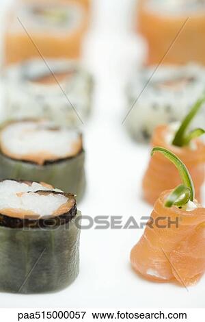 Stock Photo - Cropped view of assorted maki sushi, close-up. Fotosearch