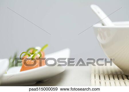 Cropped view of salmon maki sushi and bowl of soup View Large Photo Image Stock Photo - Cropped view of salmon maki sushi and bowl of soup. Fotosearch