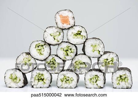 Group of maki sushi arranged in form of pyramid with single piece of salmon maki sushi at top View Large Photo Image Stock Image - Group of maki sushi arranged in form of pyramid with single piece of salmon maki sushi at top. Fotosearch