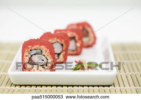 Maki sushi rolled in red flying fish roe, cross section view View Large Photo Image Stock Image - Maki sushi rolled in red flying fish roe, cross section view. Fotosearch