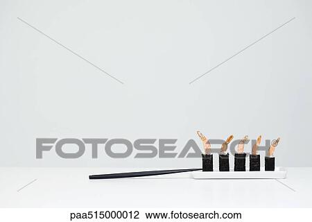 Row of shrimp maki sushi and chopsticks View Large Photo Image Stock Image - Row of shrimp maki sushi and chopsticks. Fotosearch