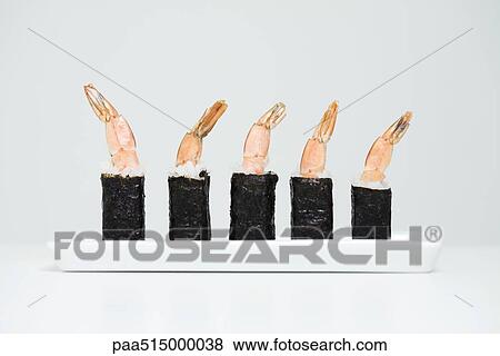 Row of shrimp maki sushi, close-up View Large Photo Image Stock Photo - Row of shrimp maki sushi, close-up. Fotosearch