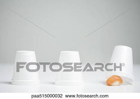 Three disposable cups in row, end cup lifted revealing single piece of nigiri sushi View Large Photo Image Stock Image - Three disposable cups in row, end cup lifted revealing single piece of nigiri sushi . Fotosearch