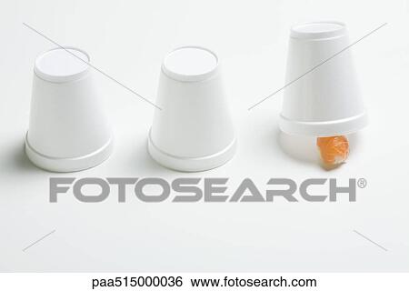 Three disposable cups in row, end cup lifted revealing single piece of nigiri sushi View Large Photo Image Stock Photograph - Three disposable cups in row, end cup lifted revealing single piece of nigiri sushi . Fotosearch