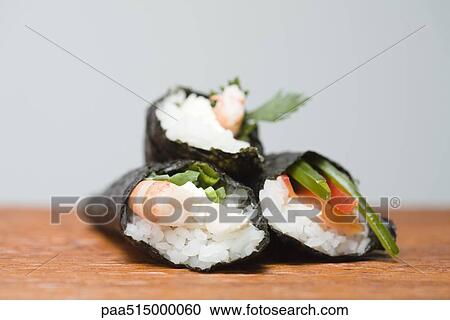 Three temaki sushi, stacked, close-up View Large Photo Image Stock Image - Three temaki sushi, stacked, close-up. Fotosearch