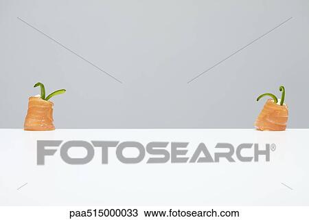 Two pieces of salmon maki sushi View Large Photo Image Stock Image - Two pieces of salmon maki sushi. Fotosearch