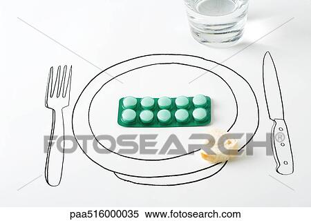 Blister pack of pills and small piece of bread on drawing of plate View Large Photo Image Stock Photography - Blister pack of pills and small piece of bread on drawing of plate. Fotosearch
