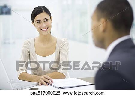 Stock Photo - Meeting between professional and client. Fotosearch