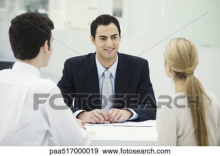 Stock Photo - Meeting between professional and clients. Fotosearch