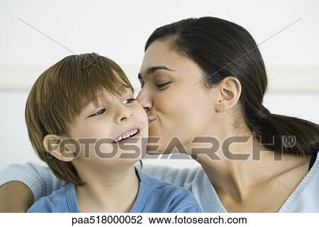 Mother kissing son on the cheek View Large Photo Image Stock Image - Mother kissing son on the cheek. Fotosearch