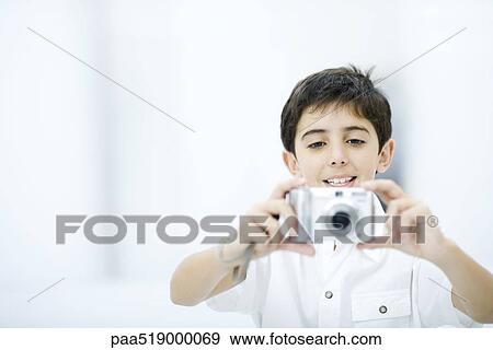 Boy taking picture with camera View Large Photo Image Stock Photo - Boy taking picture with camera. Fotosearch