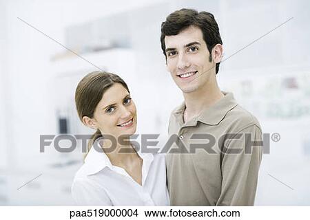 Couple smiling at camera, portrait View Large Photo Image Picture - Couple smiling at camera, portrait. Fotosearch