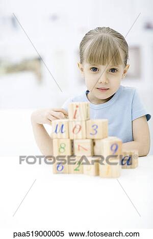 Little girl stacking blocks, looking at camera, portrait View Large Photo Image Stock Photography - Little girl stacking blocks, looking at camera, portrait. Fotosearch