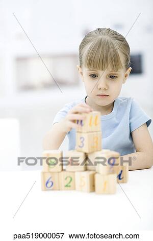 Little girl stacking blocks View Large Photo Image Stock Photo - Little girl stacking blocks. Fotosearch