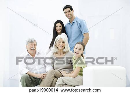 Multi-generation family smiling at camera, group portrait View Large Photo Image Picture - Multi-generation family smiling at camera, group portrait. Fotosearch