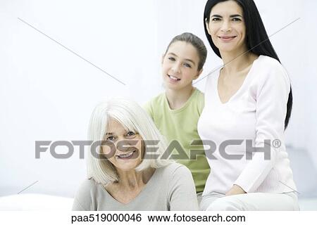 Stock Photograph - Three generations of women, portrait. Fotosearch