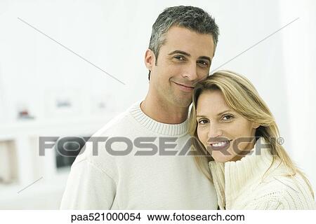 Couple smiling at camera, portrait View Large Photo Image Picture - Couple smiling at camera, portrait. Fotosearch