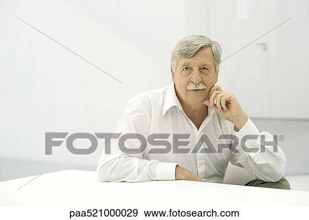 Senior man looking at camera, portrait View Large Photo Image Stock Photo - Senior man looking at camera, portrait. Fotosearch