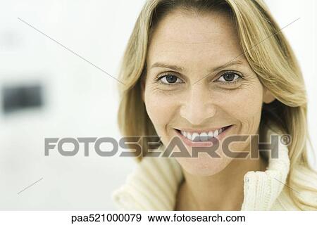 Woman smiling at camera, portrait View Large Photo Image Stock Photo - Woman smiling at camera, portrait. Fotosearch