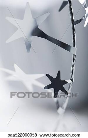 Stock Photo - Detail of ornate gift-wrap ribbon. Fotosearch