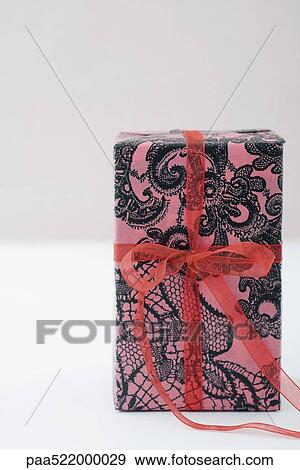 Gift wrapped present standing on end View Large Photo Image Stock Photo - Gift wrapped present standing on end. Fotosearch