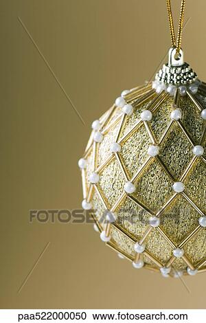 Ornate gold Christmas tree ornament View Large Photo Image Stock Image - Ornate gold Christmas tree ornament. Fotosearch