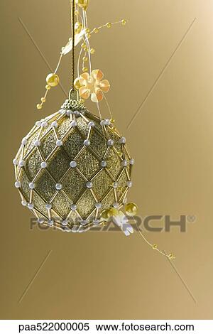 Ornate gold Christmas tree ornament View Large Photo Image Stock Photography - Ornate gold Christmas tree ornament. Fotosearch