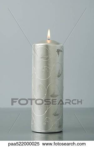 Solitary silver advent candle, burning View Large Photo Image Stock Photography - Solitary silver advent candle, burning. Fotosearch