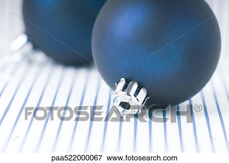 Stock Photo - Two blue Christmas tree ornaments. Fotosearch