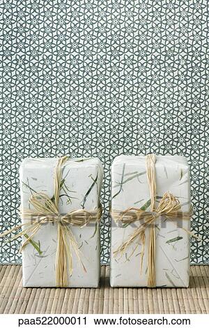 Two gift wrapped presents side by side, standing on end View Large Photo Image Stock Image - Two gift wrapped presents side by side, standing on end. Fotosearch