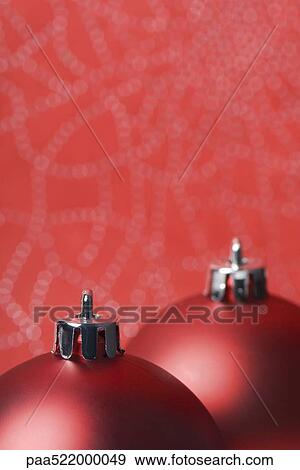 Two red Christmas tree ornaments, detail View Large Photo Image Stock Photo - Two red Christmas tree ornaments, detail. Fotosearch