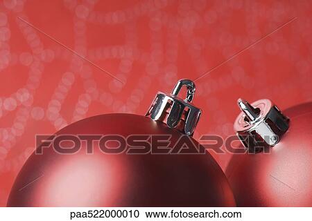Two red Christmas tree ornaments, close-up View Large Photo Image Stock Image - Two red Christmas tree ornaments, close-up. Fotosearch