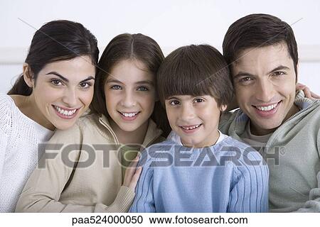 Family cheek to cheek, smiling at camera, portrait View Large Photo Image Stock Image - Family cheek to cheek, smiling at camera, portrait. Fotosearch