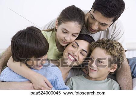 Stock Photography - Family enjoying moment of closeness. Fotosearch