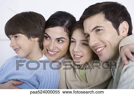 Parents and two children embracing, cheek to cheek, close-up View Large Photo Image Stock Photography - Parents and two children embracing, cheek to cheek, close-up. Fotosearch