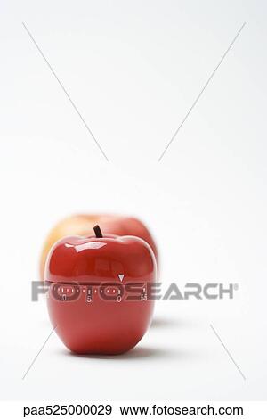 Apple shaped kitchen timer, real apple in background View Large Photo Image Stock Photo - Apple shaped kitchen timer, real apple in background. Fotosearch