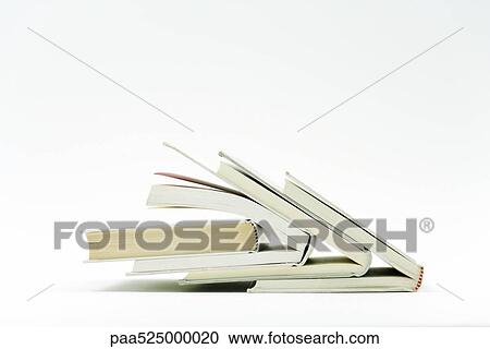 Books stacked one inside the other View Large Photo Image Stock Image - Books stacked one inside the other. Fotosearch