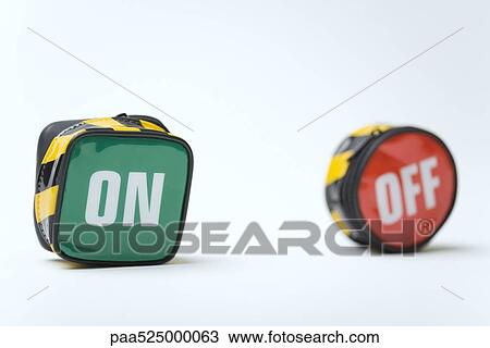 Stock Image - Coin purses printed with the words on and off. Fotosearch