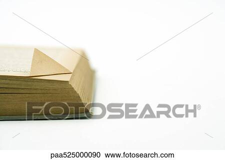 Corner of book, yellowed corner of top page folded up, close-up View Large Photo Image Stock Image - Corner of book, yellowed corner of top page folded up, close-up. Fotosearch