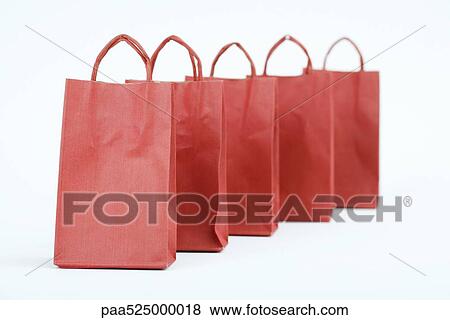 Five red shopping bags lined up View Large Photo Image Stock Photo - Five red shopping bags lined up. Fotosearch