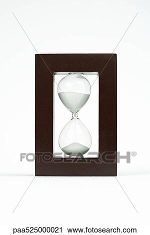 Hourglass in wooden frame View Large Photo Image Stock Image - Hourglass in wooden frame. Fotosearch