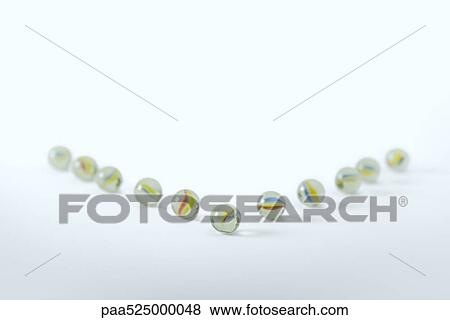 Marbles arranged to resemble arrow View Large Photo Image Stock Photo - Marbles arranged to resemble arrow . Fotosearch