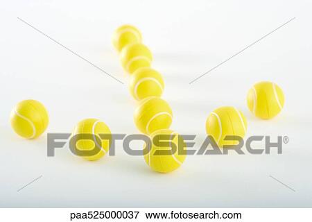 Plastic tennis balls arranged in shape of an arrow View Large Photo Image Stock Photo - Plastic tennis balls arranged in shape of an arrow. Fotosearch