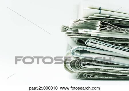 Stock Image - Stack of newspapers, close-up. Fotosearch