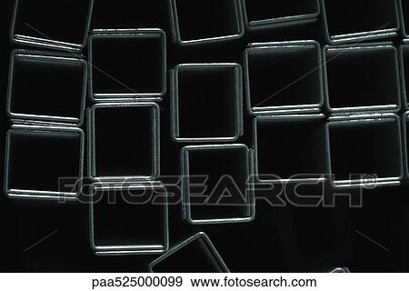 Staples forming squares on black background, close-up View Large Photo Image Stock Photo - Staples forming squares on black background, close-up. Fotosearch