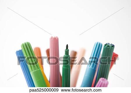 Stock Photo - Tops of multicolored felt tip pens, one missing its cap, close-up. Fotosearch
