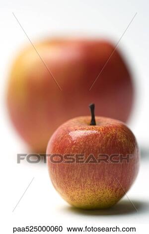Two apples, focus on smaller apple in foreground View Large Photo Image Stock Image - Two apples, focus on smaller apple in foreground. Fotosearch