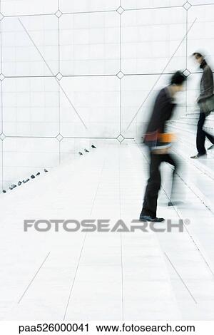 Business people passing one another going up and down steps outdoors View Large Photo Image Stock Image - Business people passing one another going up and down steps outdoors. Fotosearch