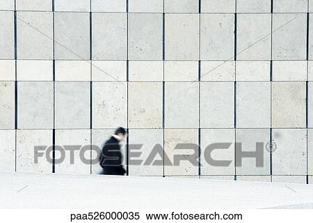 Businessman descending stairs leading down from sidewalk View Large Photo Image Stock Photography - Businessman descending stairs leading down from sidewalk . Fotosearch